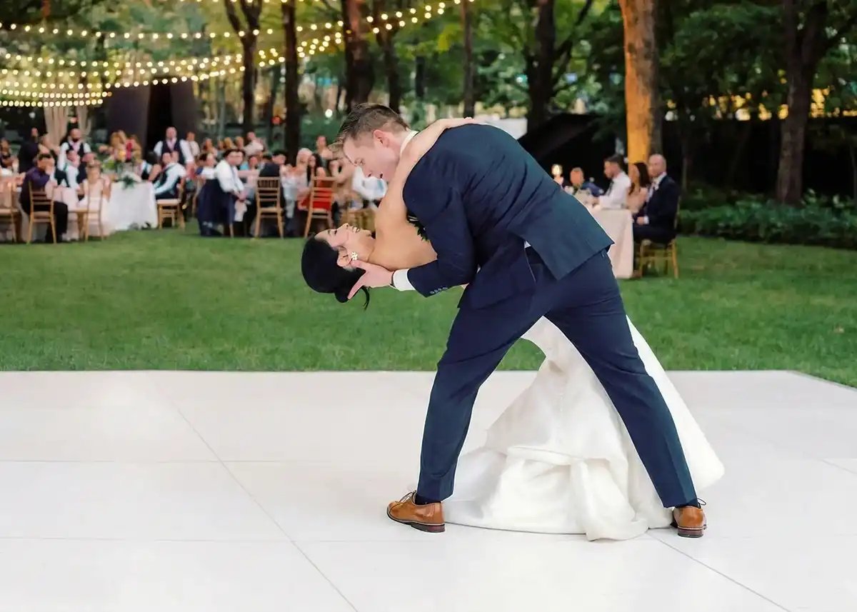Solid white dance floor set up under a tent at a Portland wedding reception