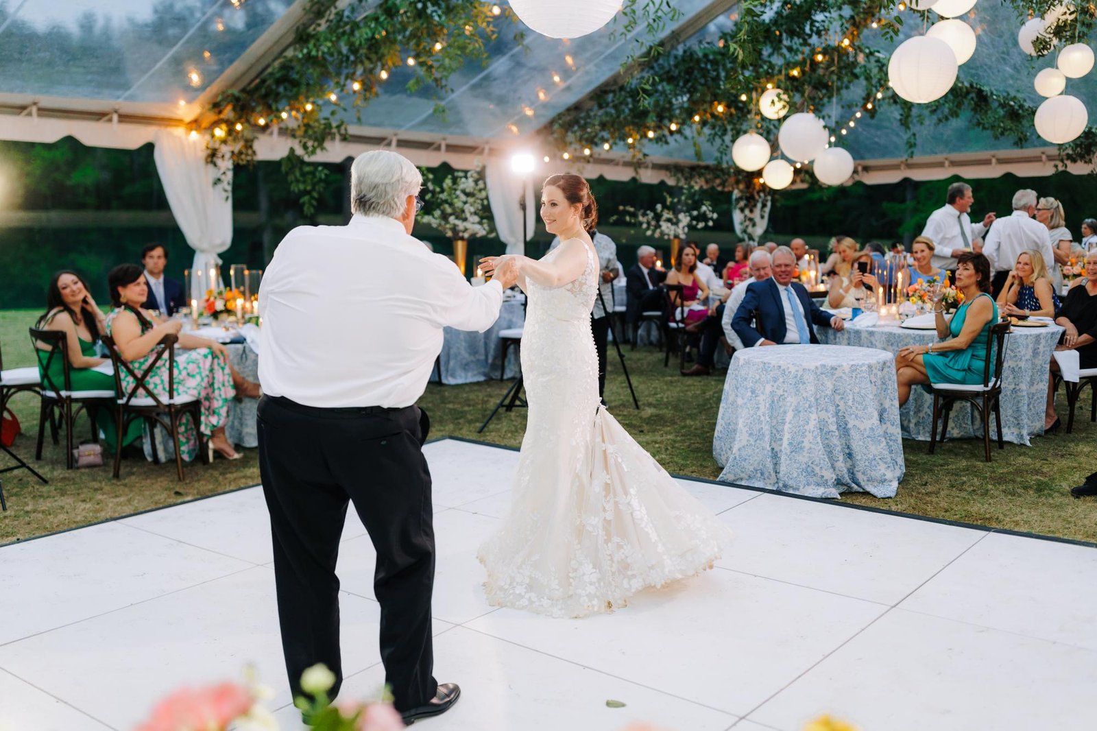 All white dance floor set up at an outdoor garden wedding reception near Portland